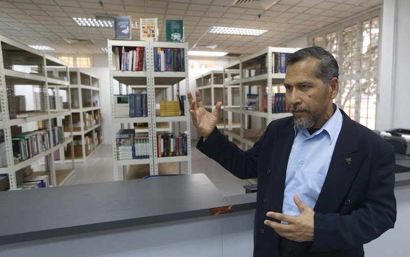 Prof Ahmad Salihin Baba conducts a tour of the new Pekan Buku bookstore at Universiti Malaya in Kuala Lumpur March 29, 2018.