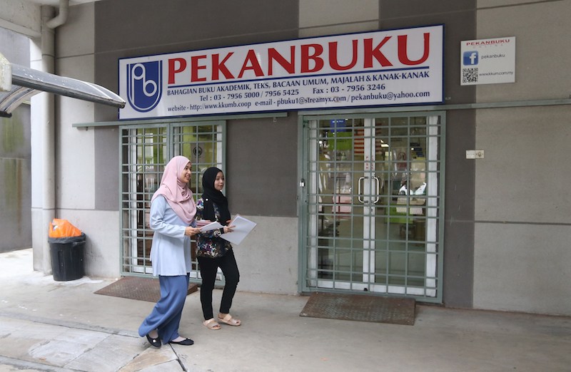 Students walk past the old Pekan Buku bookstore at Universiti Malaya in Kuala Lumpur March 29, 2018. u00e2u20acu201d Picture by Razak Ghazali