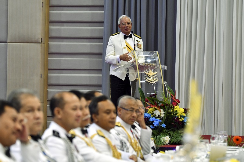 Prime Minister Datuk Seri Najib Razak (centre) speaks during the Malaysian Armed Forces and Royal Malaysia Police dinner at Wisma ATM in Kuala Lumpur March 30, 2018. u00e2u20acu201d Bernama pic