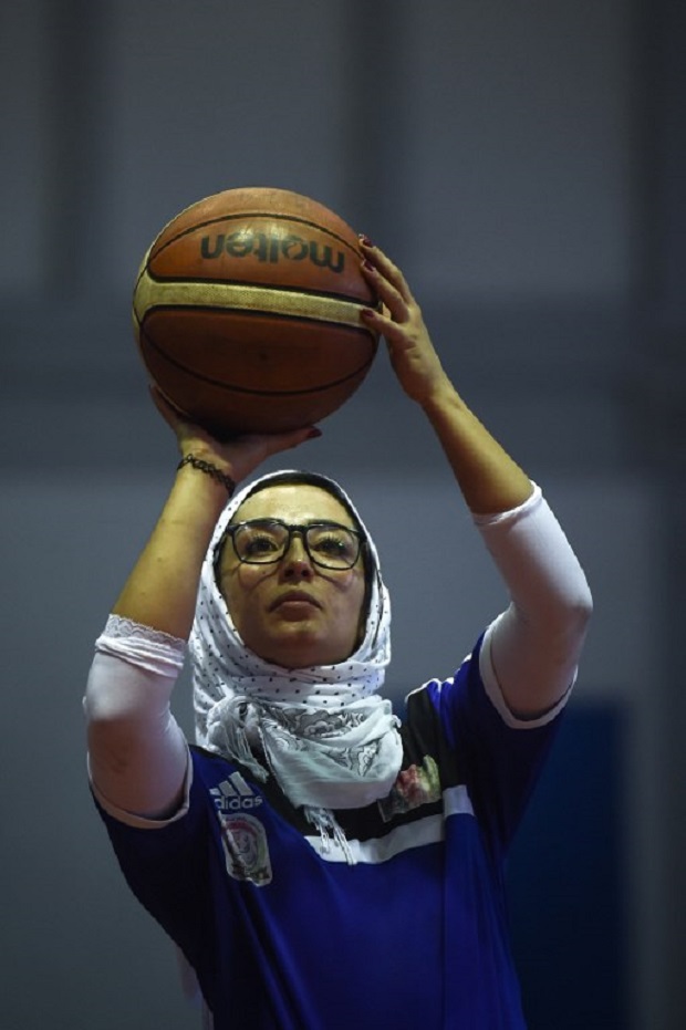 This photo taken on March 1, 2018 shows Nilofar Bayat, captain of Afghanistan's women's wheelchair basketball team, taking a free throw during a training session in the coastal province of Chonburi. u00e2u20acu201d AFP pic