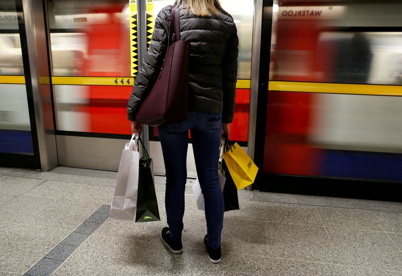 File picture shows a woman carrying her shopping bags before boarding a train on the London Underground at Waterloo Station in London, November 25, 2017. u00e2u20acu201d Reuters pic