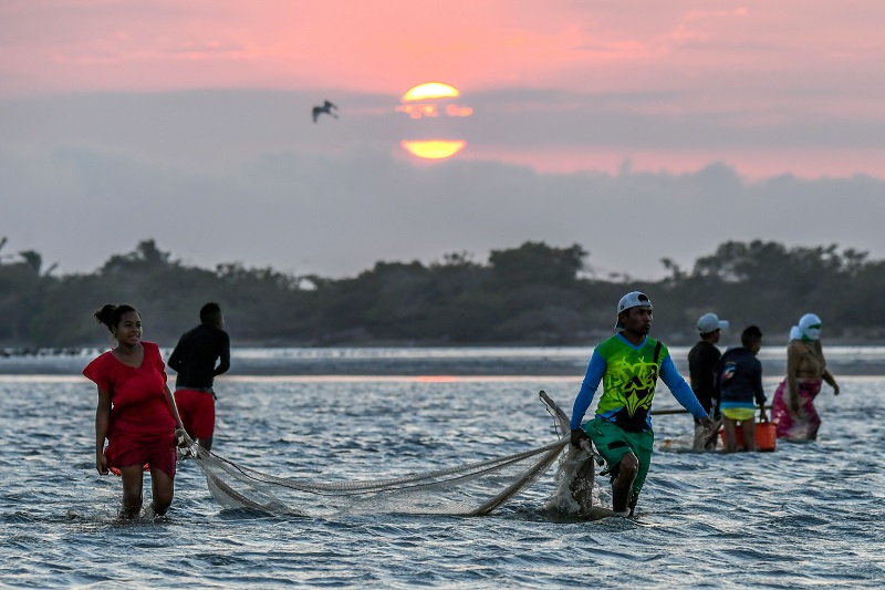 Fishermen fish shrimps at the Navio Quebrado lagoon in the village of Boca de Camarones, Guajira Department, northern Colombia March 1 2018. u00e2u20acu201d AFP pic