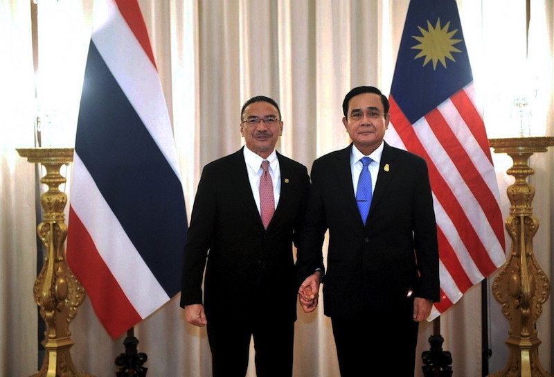 Datuk Seri Hishammuddin Hussein and Thai Prime Minister Prayuth Chan-ocha pose for pictures during their meeting in Bangkok March 15, 2018. u00e2u20acu201d Bernama pic