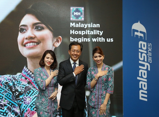 Malaysia Airlines Bhd Group CEO Captain Izham Ismail poses with stewardesses after the launch of the newly refurbished Golden Lounge in KLIA in Sepang March 22, 2018. u00e2u20acu201d Picture by Zuraneeza Zulkifli