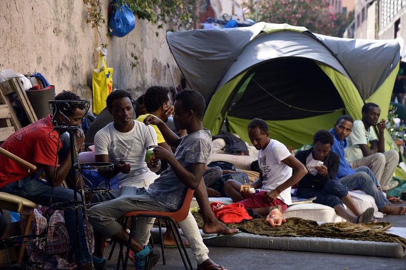 Migrants sit in the street of Via Cupa just outside the former Baobab migrants reception centre next to the Tiburtina train station in Rome August 8, 2016. u00e2u20acu2022 AFP pic
