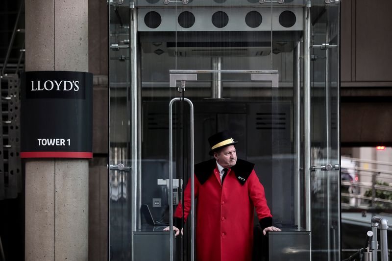 A doorman stands outside the Lloydu00e2u20acu2122s of London building in the City of London financial district in London, February 1, 2018. u00e2u20acu201d Reuters pic