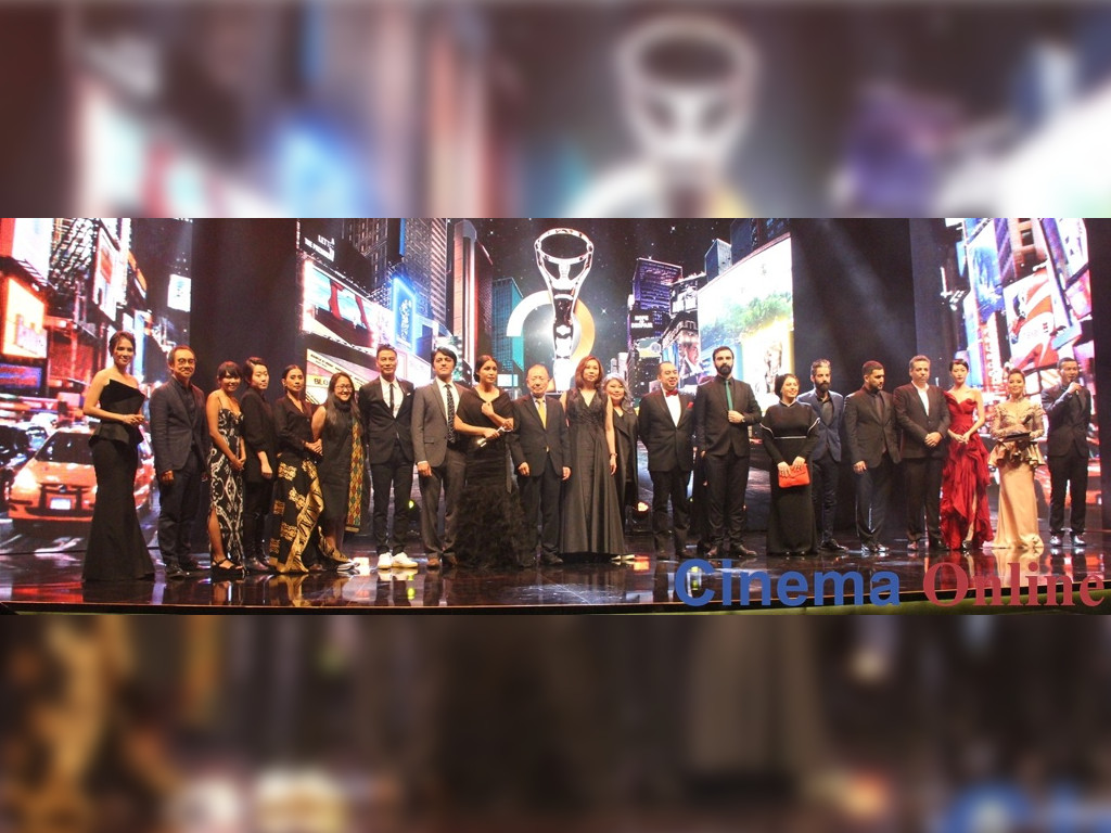 The winners of the Malaysia Golden Global Awards pose on stage with their awards. u00e2u20acu201d CinemaOnline pic