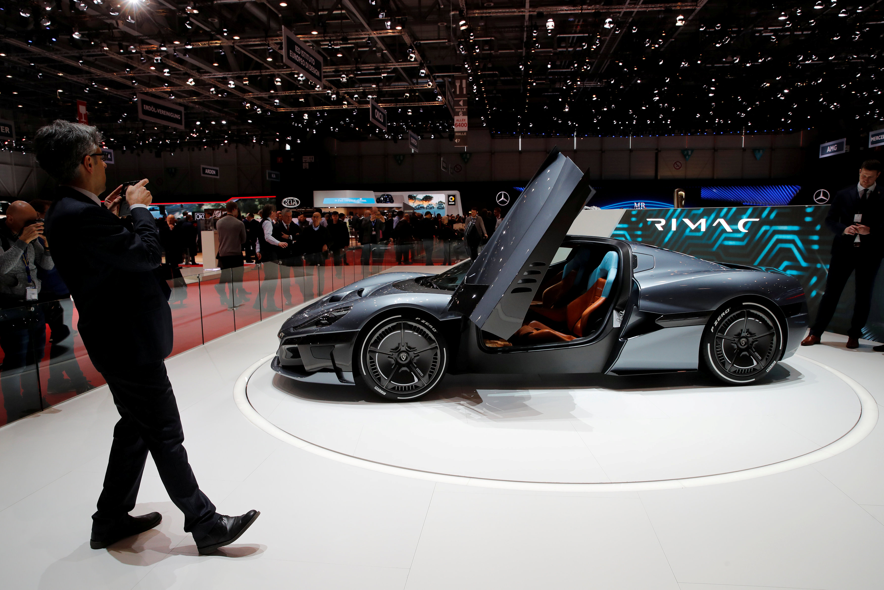 A visitor takes a picture of the Rimac Concept 2 model car during the 88th Geneva International Motor Show in Geneva, Switzerland, March 7, 2018. u00e2u20acu201d Reuters pic