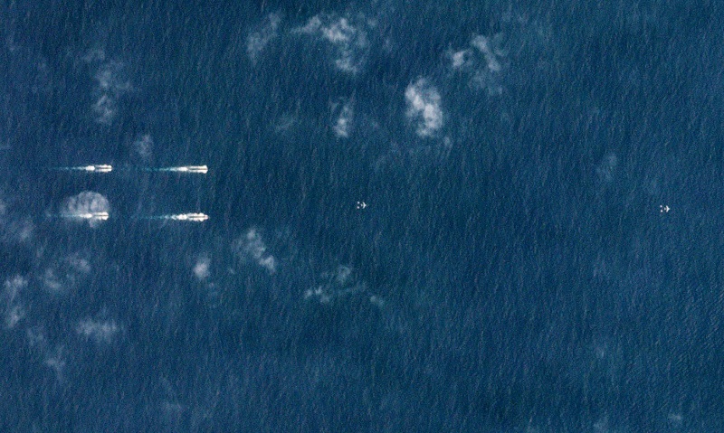 Satellite image provided by Planet Labs dated March 26, 2018 shows Chinese ships south of Hainan, China. u00e2u20acu201d Reuters pic  
