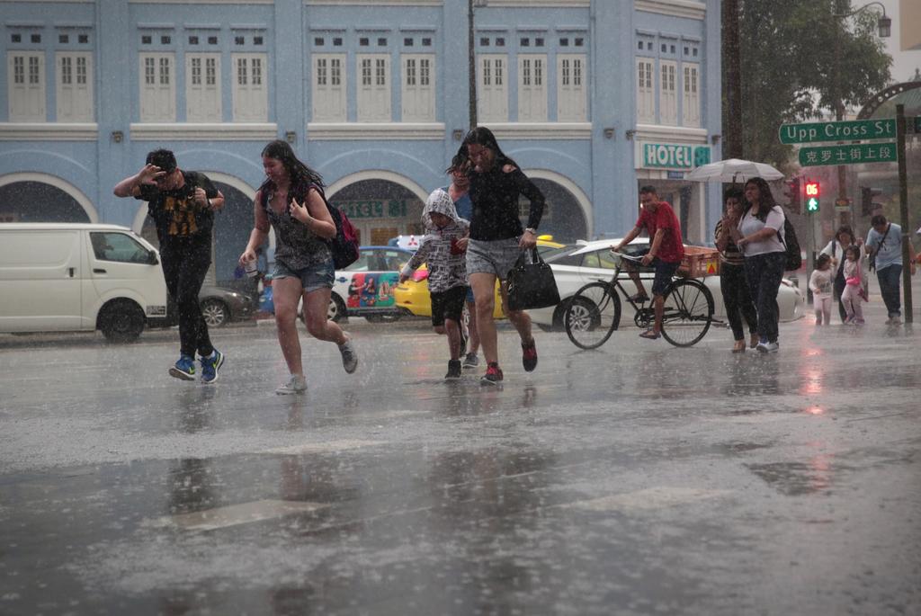 Start packing your umbrella in the bag again as you head out, with more showers forecasted in the next two weeks as compared to the last fortnight. u00e2u20acu201d Picture by Jason Quah/TODAY