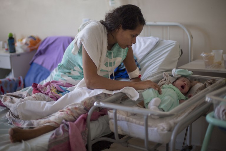 Venezuelan refugee Dayana Rodriguez, 17, takes care of her newborn daughter Sofia, 12 days, at the Maternity Hospital Nossa Senhora de Nazare in the city of Boa Vista, Roraima, Brazil February 26, 2018. u00e2u20acu201d AFP pic