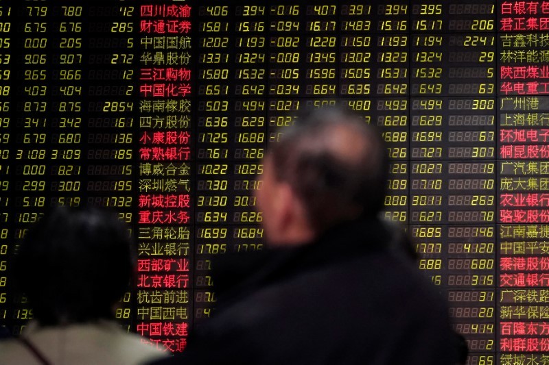 Investors look at an electronic board showing stock information at a brokerage house in Shanghai, China February 9, 2018. u00e2u20acu201d Reuters pic