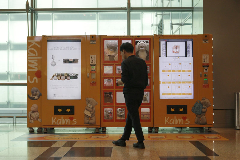 A traveller browses gifts at a vending machine by premium gift brand Kalms at Singaporeu00e2u20acu2122s Changi Airport Terminal 3 March 6, 2018. u00e2u20acu201d Reuters pic