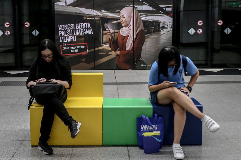 An advertisement discouraging the dissemination of fake news is pictured at a train station in downtown Kuala Lumpur March 26, 2018. u00e2u20acu201d Picture by Hari Anggara