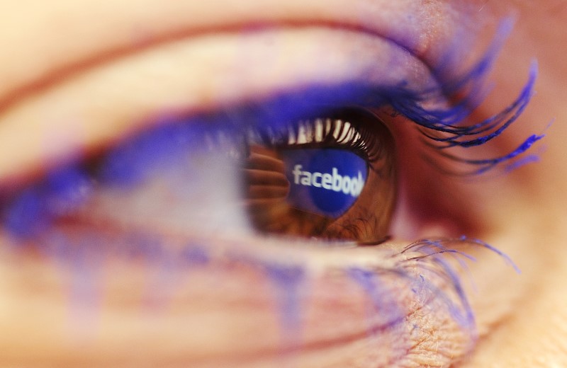 A Facebook logo reflected in the eye of a woman is seen in this picture illustration taken in Skopje November 6, 2014. u00e2u20acu201d Reuters pic 
