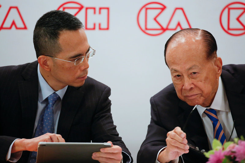 Li Ka-shing listens to his son Victor Li, Co-Managing Director and Deputy Chairman of CK Hutchison Holdings Limited, during a news conference in Hong Kong March 16, 2018. u00e2u20acu201d Reuters pic