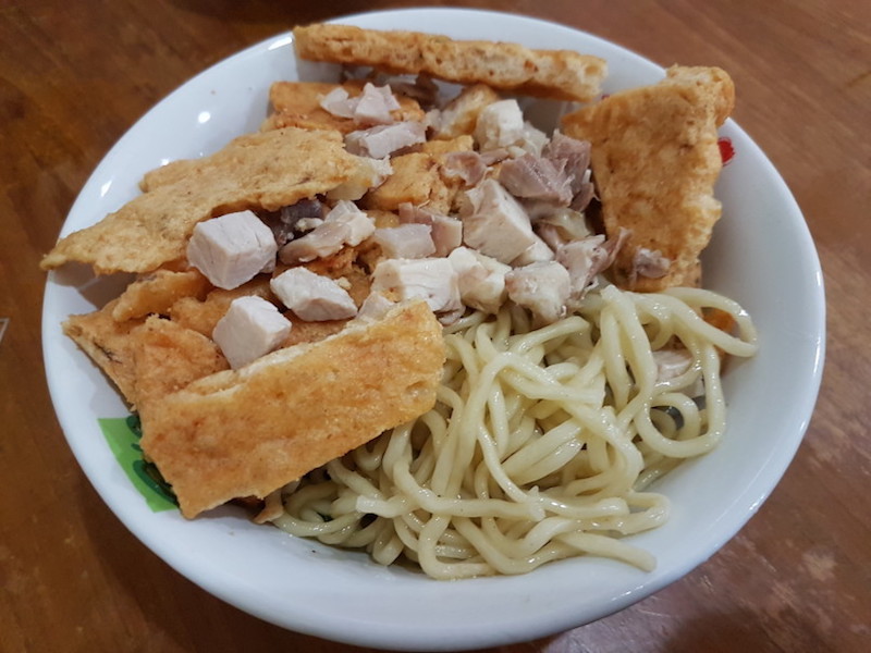 Bakmi Tan’s signature bowl of noodles is topped with shrimp crackers. — Jakarta Globe pic 