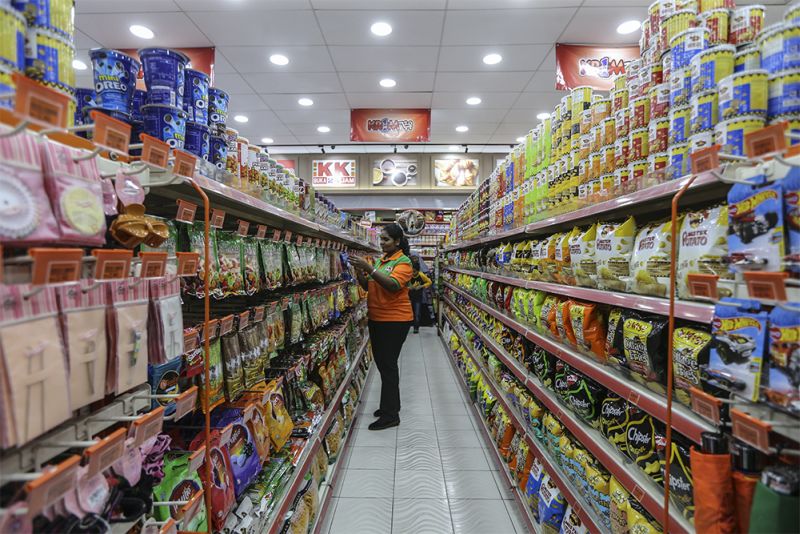A customer browses through products at the KK Super Mart at Bandar Tasik Selatan March 21, 2018. u00e2u20acu2022 Picture by Azneal Ishak