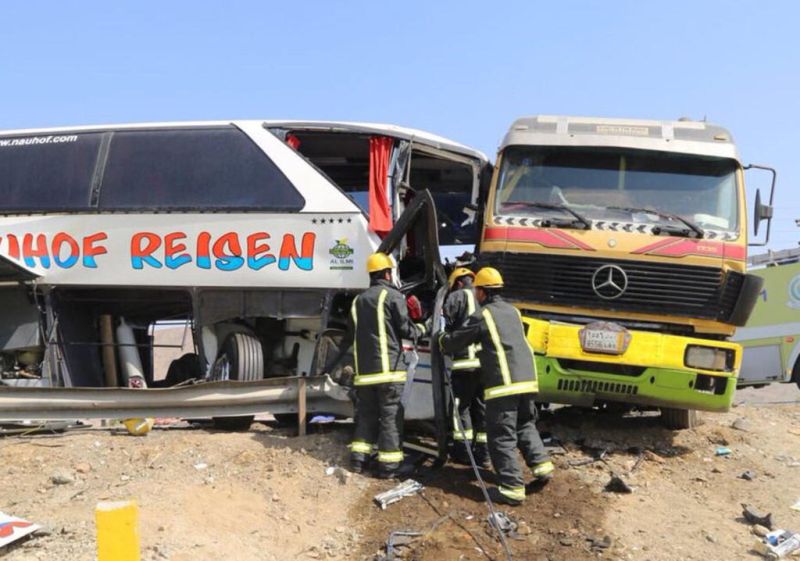 Saudi firefighters at the scene of the accident, after a lorry crashed into the bus carrying the 31 passengers. u00e2u20acu201d TODAY pic