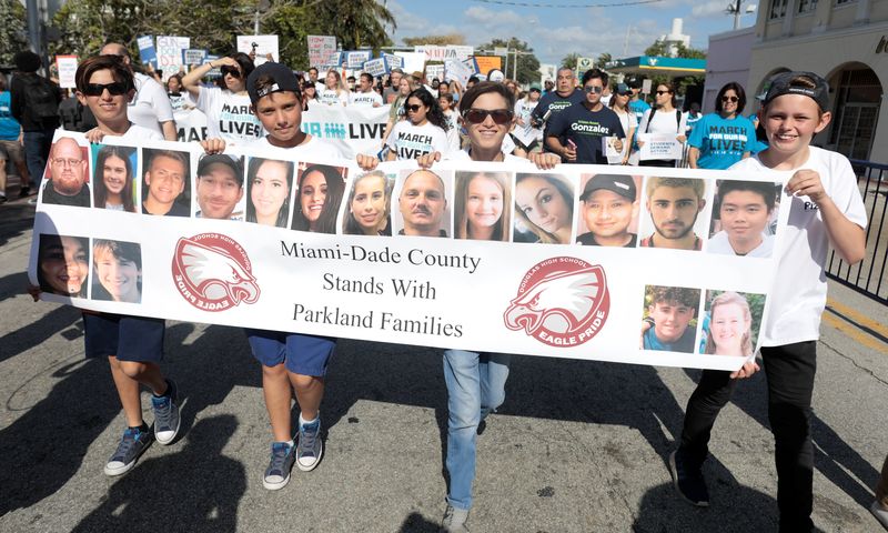 Students hold a banner with the victims of Parkland School while rallying in the street during the u00e2u20acu02dcMarch for Our Livesu00e2u20acu2122 demanding stricter gun control laws at the Miami Beach Senior High School, in Miami, Florida, March 24, 2018. u00e2u20acu201d Reuters pic