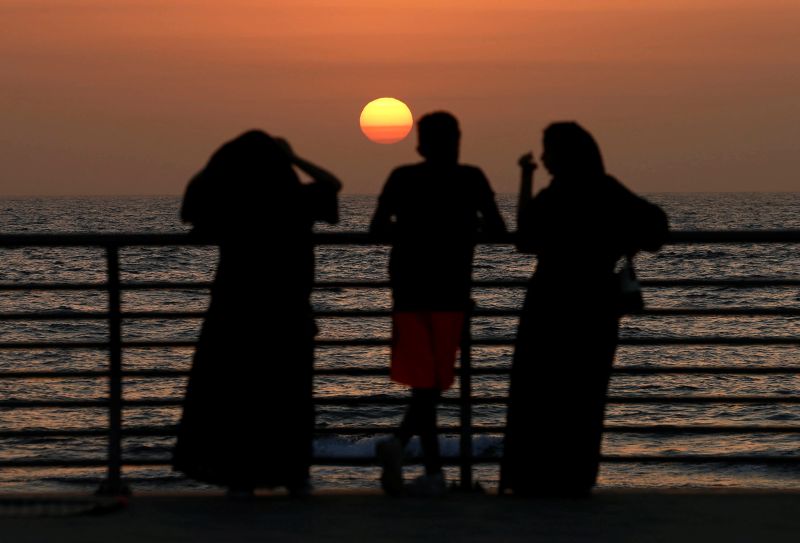 People stand on the corniche at sunset in Jeddah, Saudi Arabia March 16, 2018. u00e2u20acu201d Reuters pic