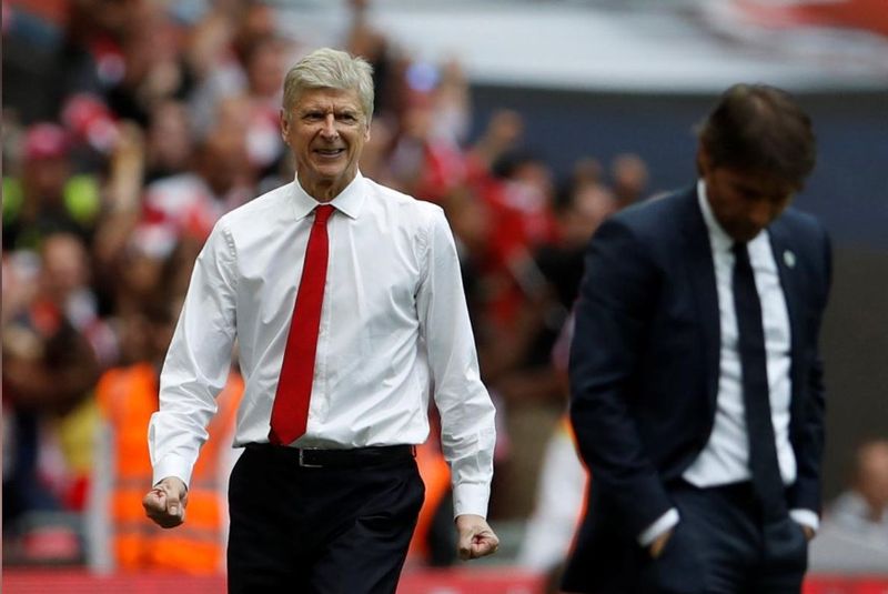 Arsenal manager Arsene Wenger celebrates after Aaron Ramsey (not pictured) scores their second goal as Chelsea manager Antonio Conte looks dejected during the FA Cup Final in Wembley Stadium, May 27, 2017. u00e2u20acu201d Reuters pic