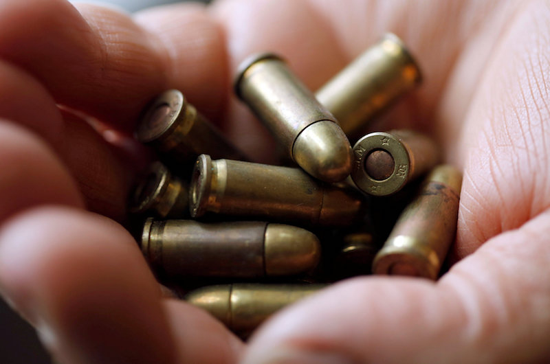 A weapon collector holds bullets in his house in Bordeaux, France, March 19, 2018. u00e2u20acu201d Reuters pic