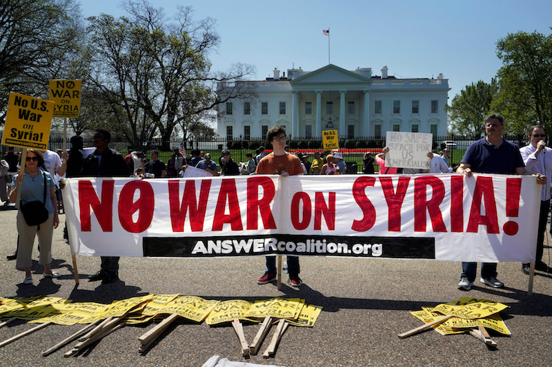 Demonstrators protest after the missile strikes on Syria, outside the White House in Washington April 14, 2018. — Reuters pic