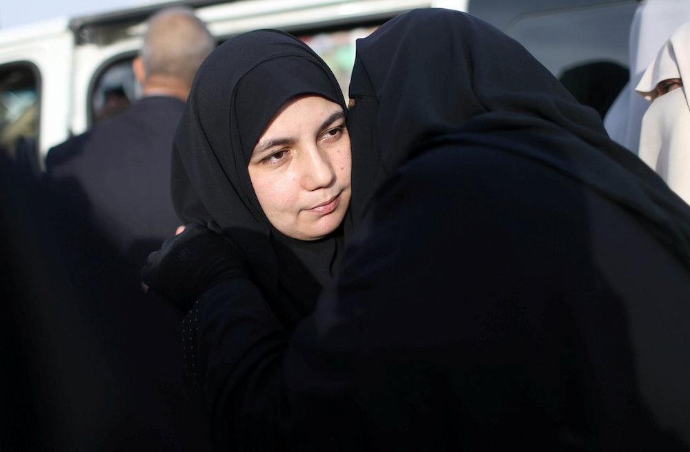 The wife of Palestinian engineering lecturer Fadi al-Batsh, who was shot dead in Malaysia, is hugged upon her husbandu00e2u20acu2122s body arrival in the southern Gaza Strip, April 26, 2018. u00e2u20acu201d Reuters pic