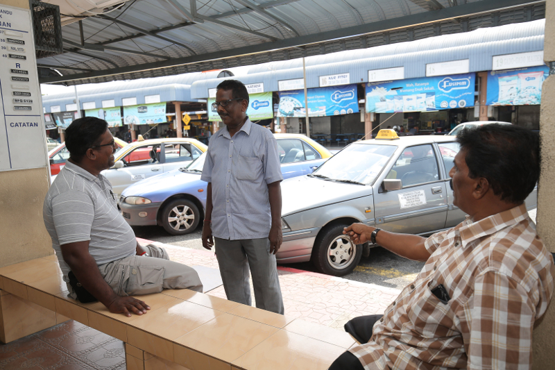 Taxi driver K. Subramaniam, 65 , (middle) said that incumbent Datuk Seri Mah Siew Keong could win in Teluk Intan if people vote based on the candidate performance in the 14th  general election. u00e2u20acu2022 Picture by Marcus Pheong