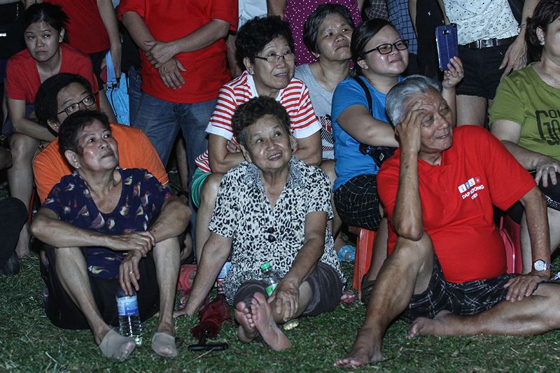 Most of the crowd stood for hours during the ceramah held at the field in front of the Jinjang police station, while some sat down to hear the speeches.