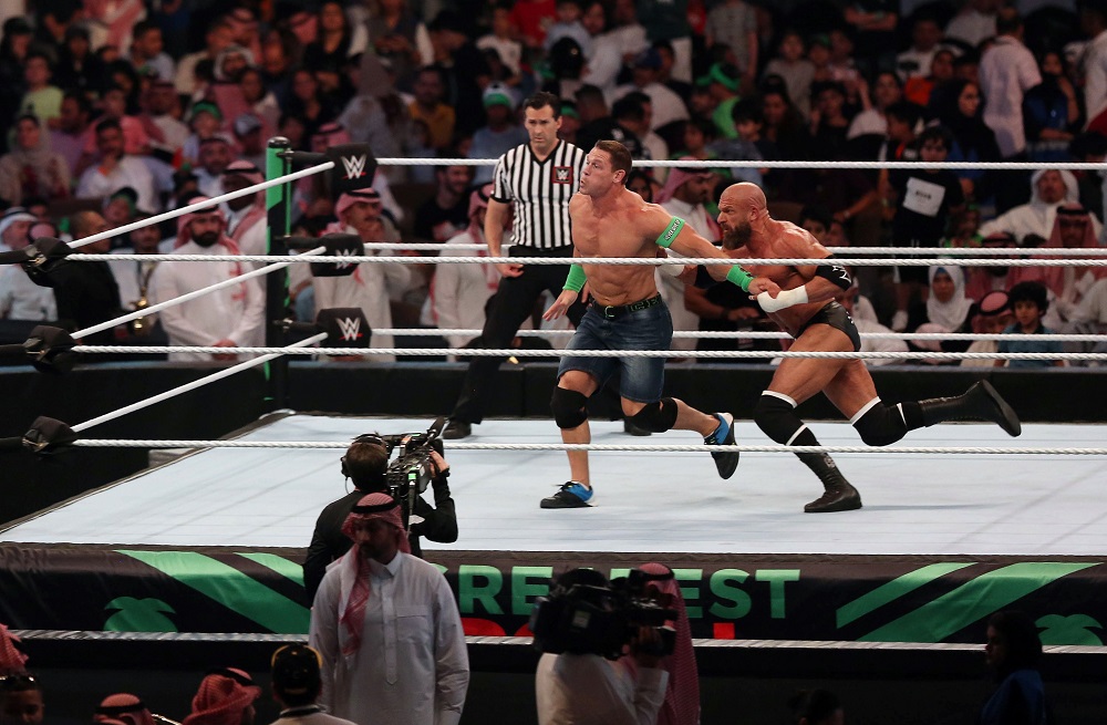 John Cena (centre) competes with Triple H (R) during the World Wrestling Entertainment (WWE) Greatest Royal Rumble event in the Saudi coastal city of Jeddah April 28, 2018. u00e2u20acu201d AFP pic