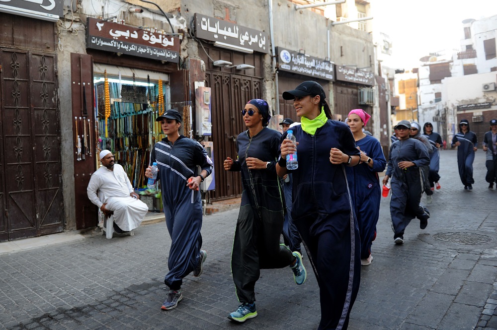 Saudi women jog in the streets of Jeddah’s historic al-Balad district March 8, 2018. — AFP pic