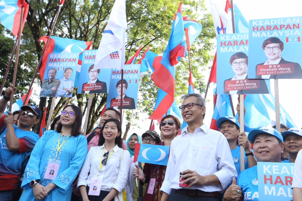 Pakatan Harapan Damansara candidate Tony Pua (second left), and Bukit Lanjan candidate Elizaberth Wong (third left) are seen at the Damansara nomination centre in Petaling Jaya April 28, 2018. u00e2u20acu2022 Picture by Zuraneeza Zulkifli