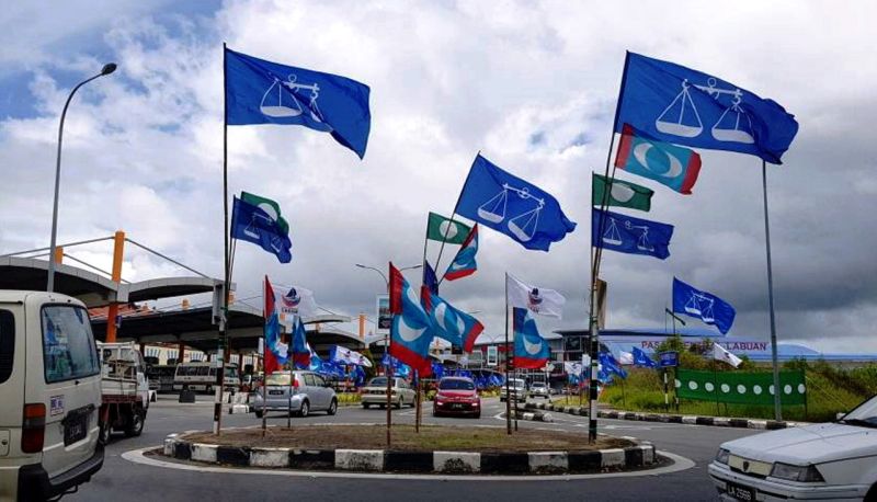 Flags and banners of political parties are seen in Labuan ahead of the 14th general election. u00e2u20acu2022 Bernama pic