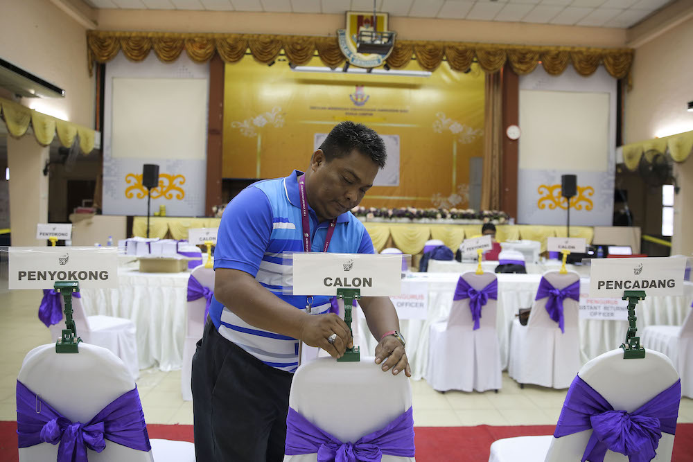 An election officer makes final preparations ahead of nomination day in Dewan Bestari Sekolah Menengah Aminuddin Baki in Kampung Pandan, Kuala Lumpur April 27, 2018. u00e2u20acu201d Picture by Yusof Mat Isa