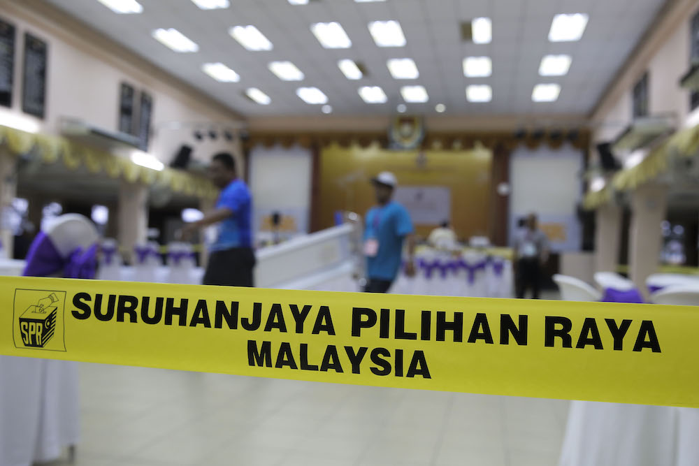 An election officer makes final preparations ahead of nomination day in Dewan Bestari Sekolah Menengah Aminuddin Baki in Kampung Pandan, Kuala Lumpur April 27, 2018. u00e2u20acu201d Picture by Yusof Mat Isa