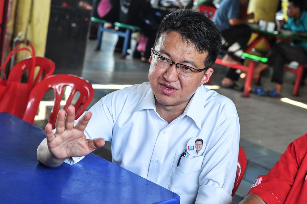 Pakatan Harapan's  Ayer Hitam candidate Liew Chin Tong speaks to the media at the Parit Raja wet market on April 30, 2018. u00e2u20acu201d Picture by Shafwan Zaidon