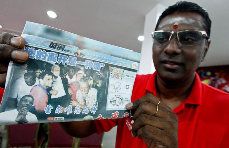 RSN Rayer shows a photo of a newspaper cutting of him helping the late Karpal Singh in his campaigns, April 23, 2018. u00e2u20acu2022 Picture by Sayuti Zainudin