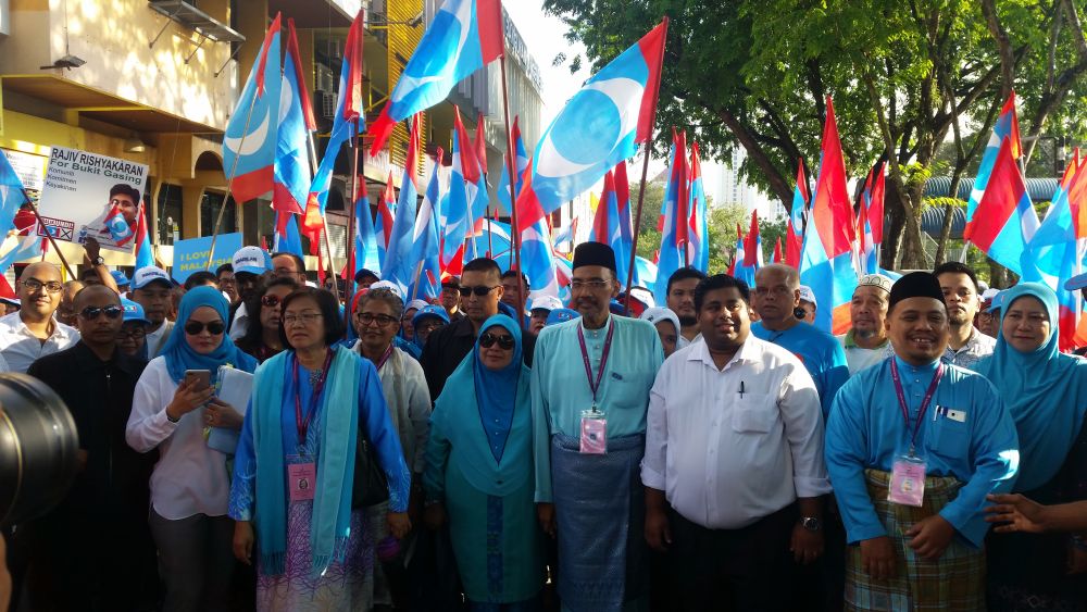 Pakatan Harapan candidates Maria Chin Abdullah, Prof Shaharuddin Badaruddin, Rajiv Rishyakaran and Syamsul Firdaus Mohamed Supri march to the nomination centre in Petaling Jaya April 28, 2018. u00e2u20acu2022 Picture by Ida Lim