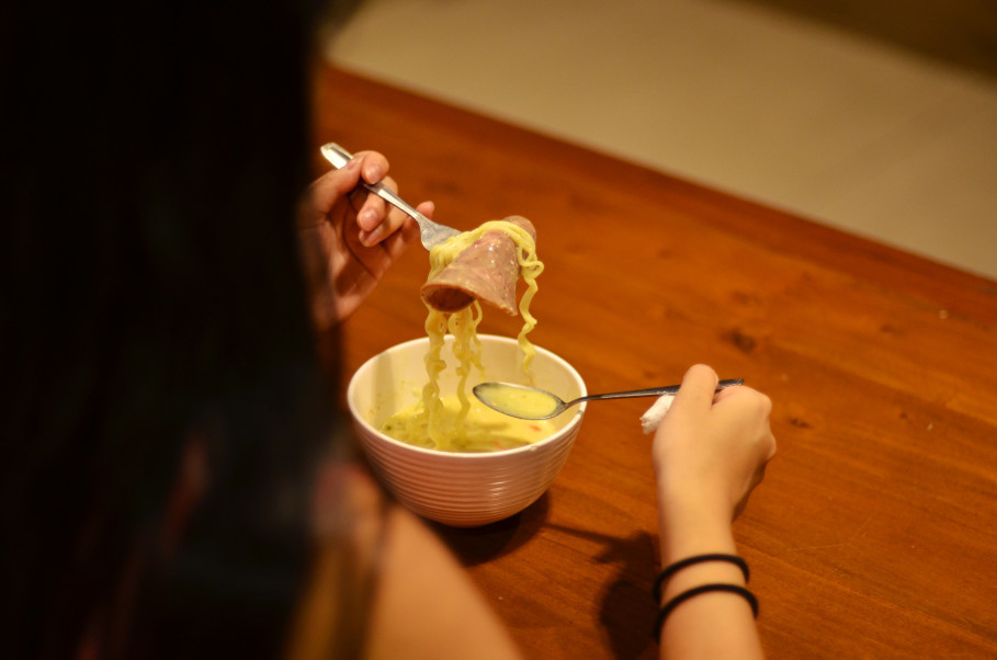 A bowl of Indomie with cheesy sauce at Warunk Upnormal. — Jakarta Globe pic