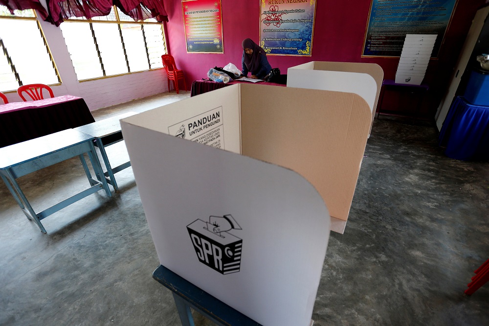 An election volunteer works a day before the 14th general election at a polling station in Alor Setar May 8, 2018. u00e2u20acu201d Reuters pic