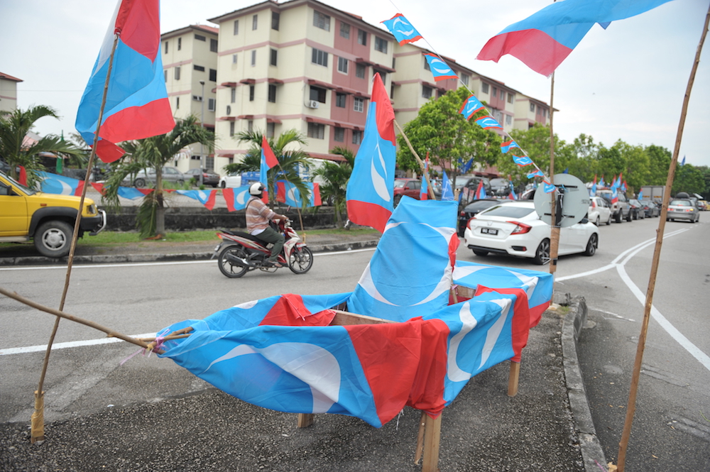 A boat covered with PKR flags is displayed at the junction of Jalan Permatang Pauh, May 6, 2018. u00e2u20acu201d Picture by KE Ooi