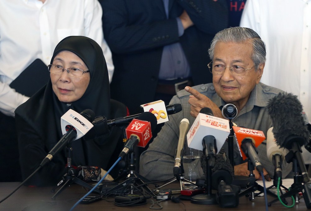 Tun Dr Mahathir Mohamad and Datuk Seri Wan Azizah at a news conference following the general election in Petaling Jaya May 10, 2018. u00e2u20acu201d Picture by Razak Ghazali