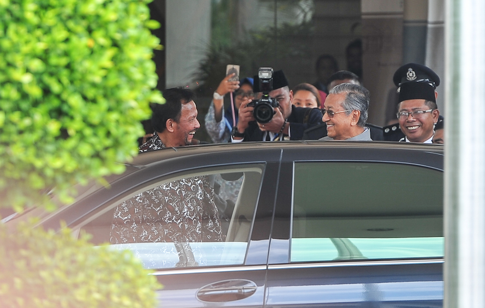 Sultan of Brunei Sultan Hassanal Bolkiah arrives for a special meeting with Prime Minister Tun Dr Mahathir Mohamad at the Perdana Leadership Foundation in Putrajaya May 14, 2018. u00e2u20acu201d Picture by Shafwan Zaidon