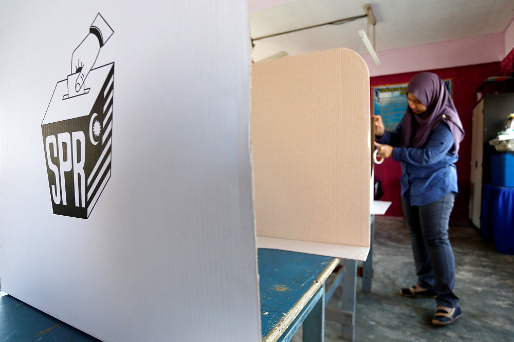 An election volunteer works a day before the 14th general election at a polling station in Alor Setar May 8, 2018. u00e2u20acu201d Reuters pic