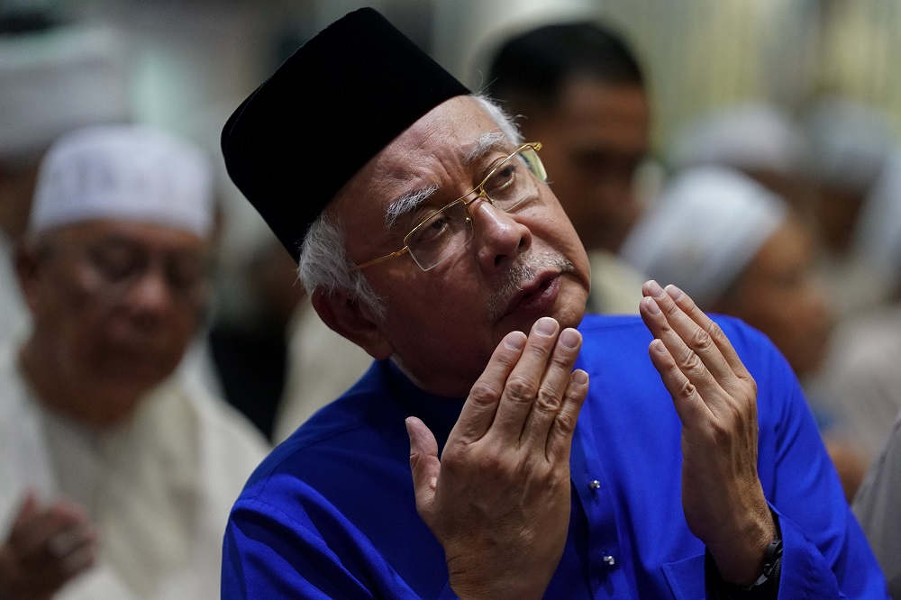 Datuk Seri Najib Razak offers special prayers a day before the 14th general election at a mosque in Pekan May 8, 2018. u00e2u20acu201d Reuters pic