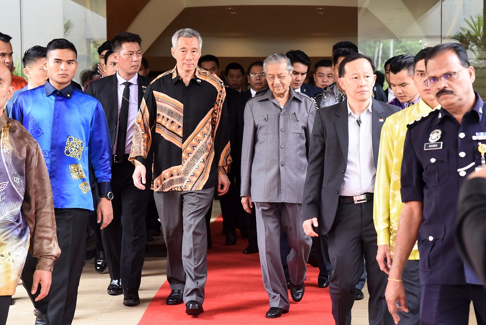 Singaporeu00e2u20acu2122s Prime Minister Lee Hsien Loong walks with Prime Minister Tun Dr Mahathir Mohamad prior to their private meeting in Putrajaya May 19, 2018. u00e2u20acu201d Reuters pic