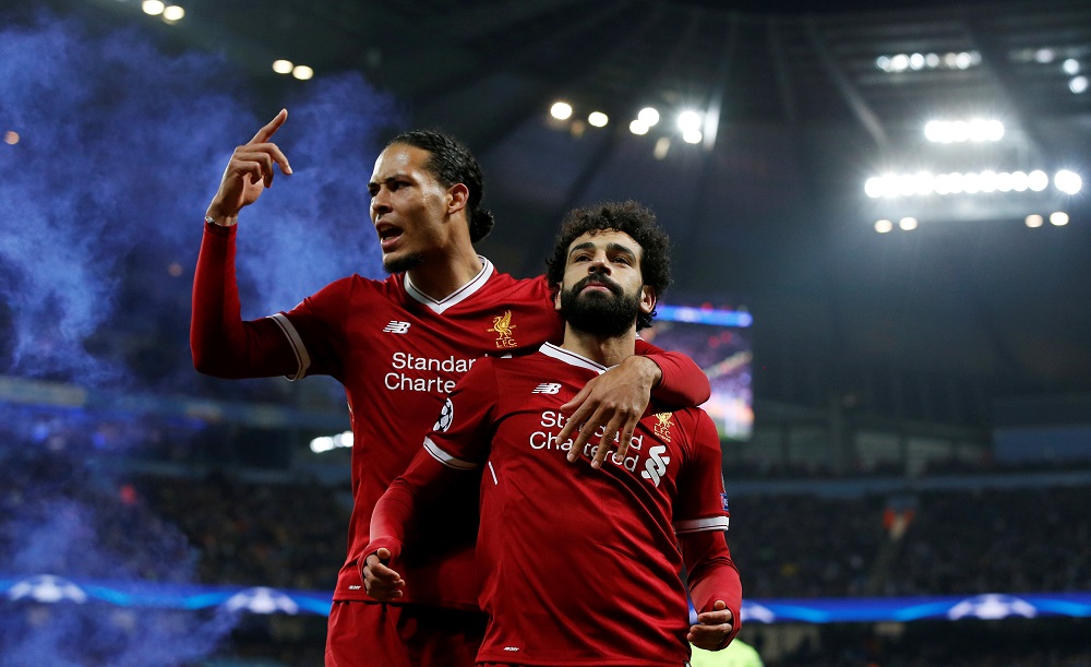 Liverpool’s Mohamed Salah celebrates scoring their first goal with Virgil van Dijk during the Champions League Quarter Final Second Leg at the Etihad Stadium in Manchester April 10, 2018. — Reuters pic