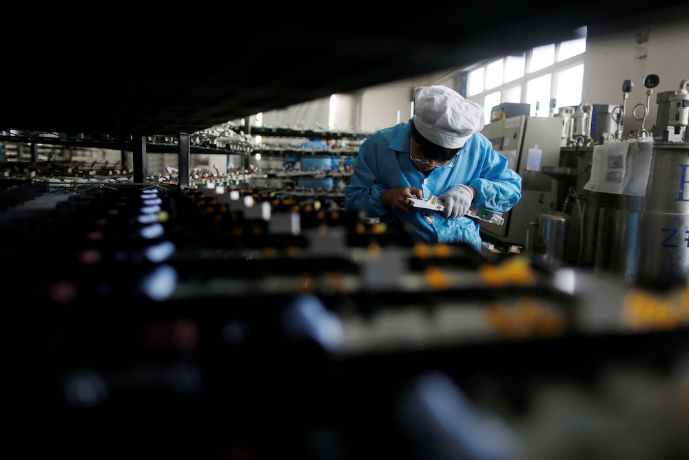A labourer works inside an electronics factory in Qingdao, Shandong province, China January 29, 2018. u00e2u20acu201d Reuters pic